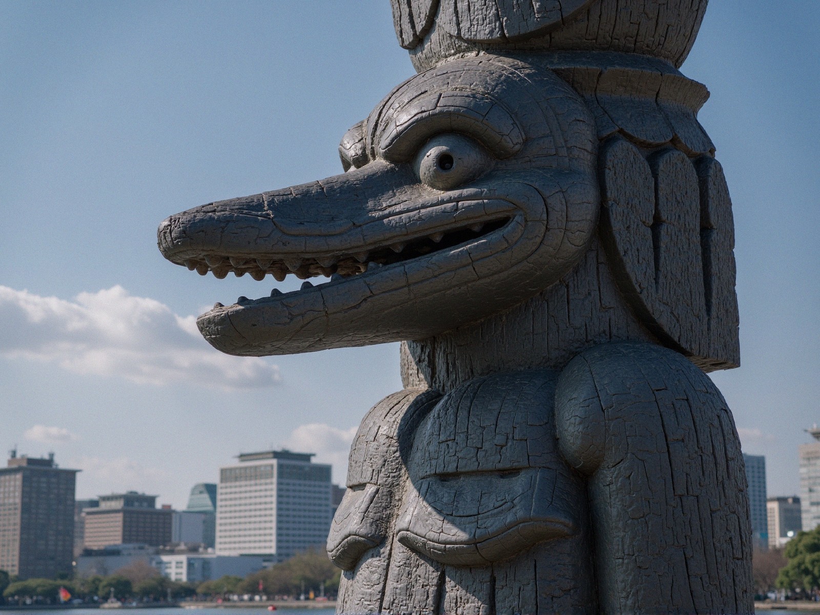 Wooden Sculpture of Crocodile-Like Creature in Cityscape