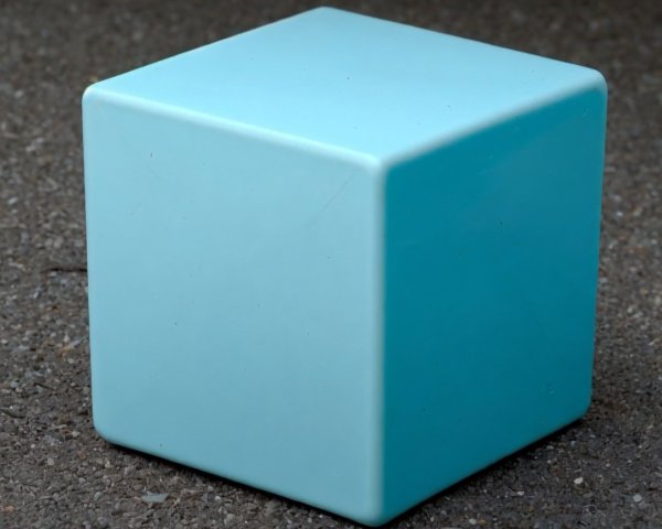 Glossy Turquoise Cube on Textured Gray Surface