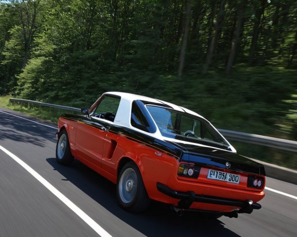 Classic Black and Orange Coupe on Scenic Road