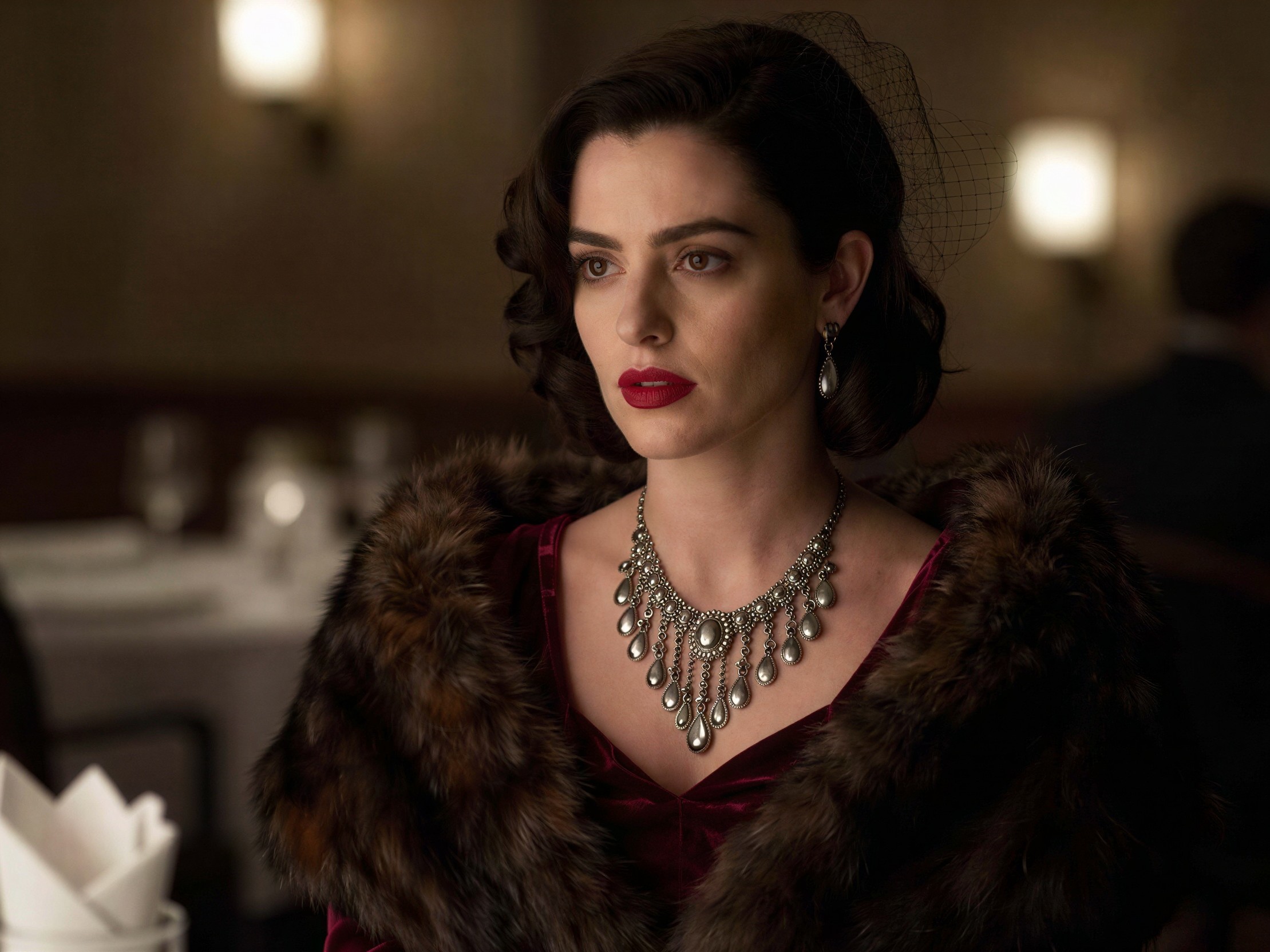 Woman in Dark Red Dress with Brown Fur Stole