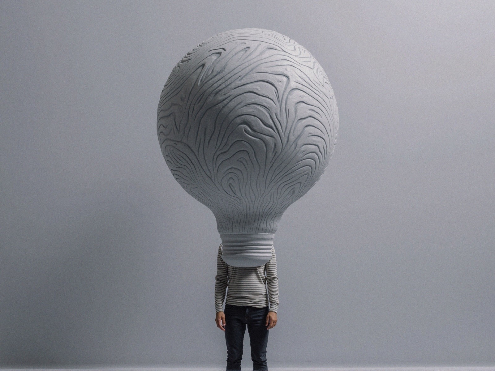 Person with Light Bulb Head in Minimalist Setting