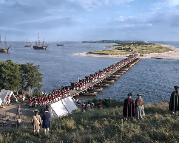 Historical military camp near waterfront with soldiers