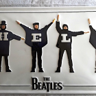 Paper Cutout Illustration of The Beatles in Suits