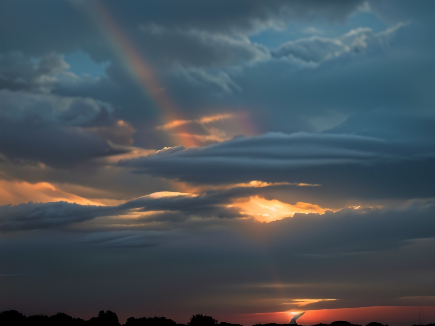 Dramatic Sunset Sky with Clouds and Rainbow