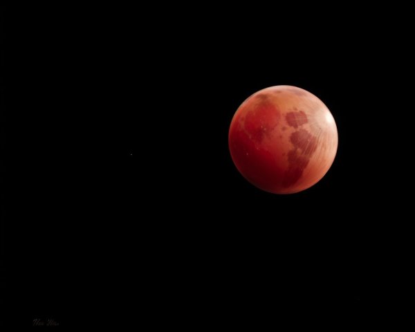 Blood-Red Moon Against Black Backdrop with Textures