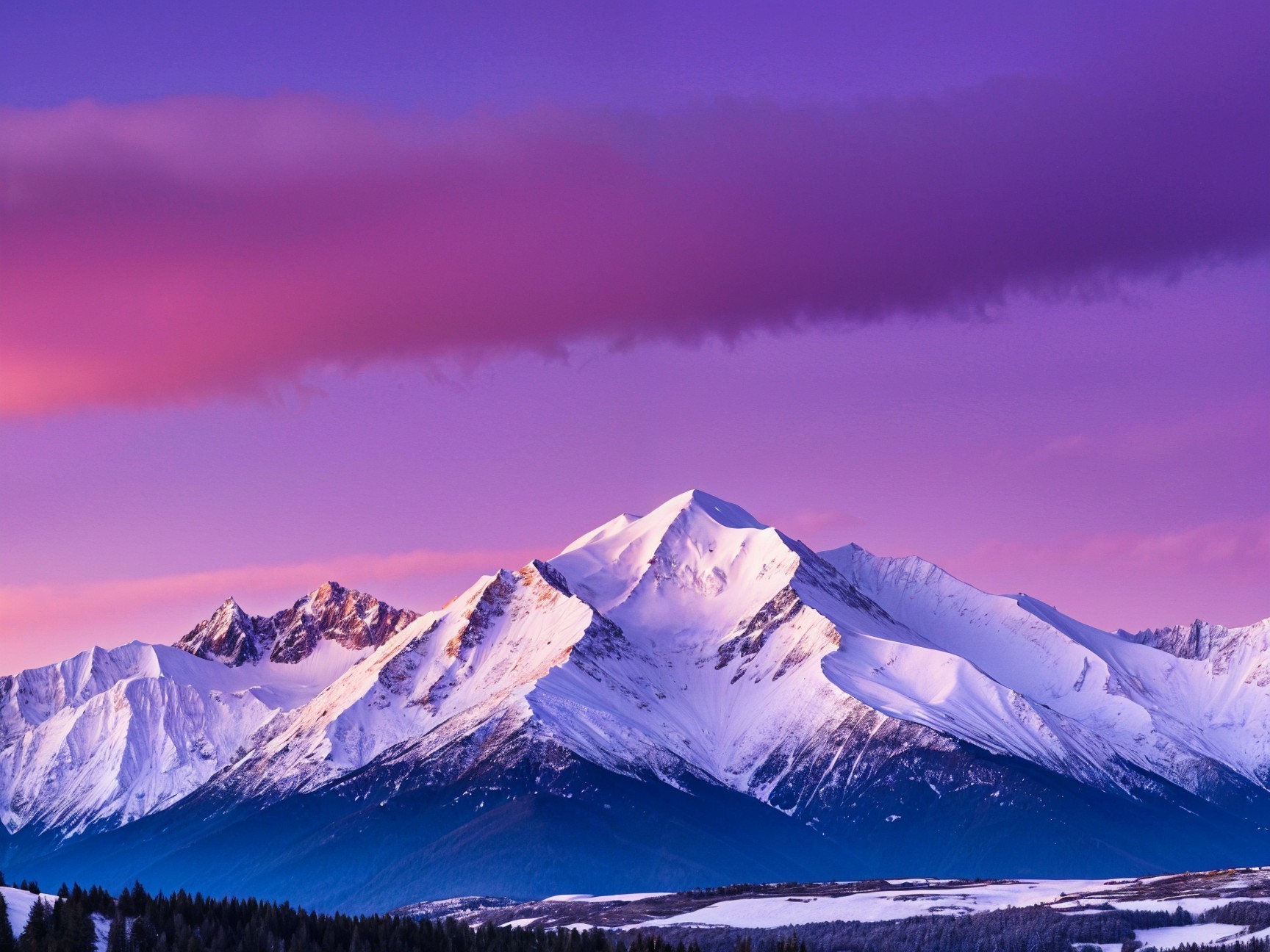 Snow-Capped Mountains Against a Colorful Sunset Sky
