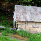 Rustic Wooden Shed in Serene Countryside Setting