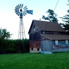 Rustic farmhouse with windmill in serene countryside