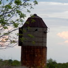 Wooden Structure Against Blue Sky and Fluffy Clouds
