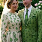 Elegant Couple in Opulent Outfits and Vibrant Jewels