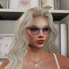 Young woman with blonde hair in cozy, chic setting