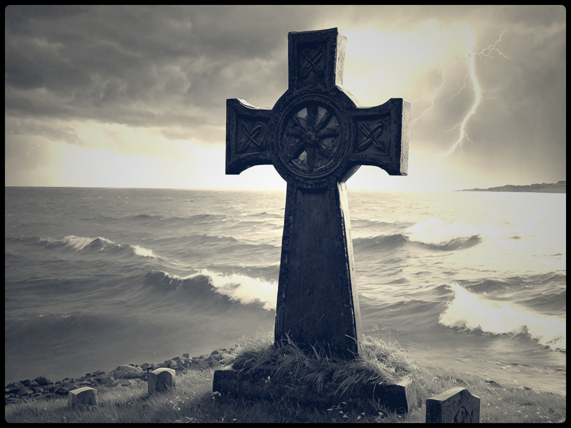 Weathered Stone Cross Against Stormy Seascape