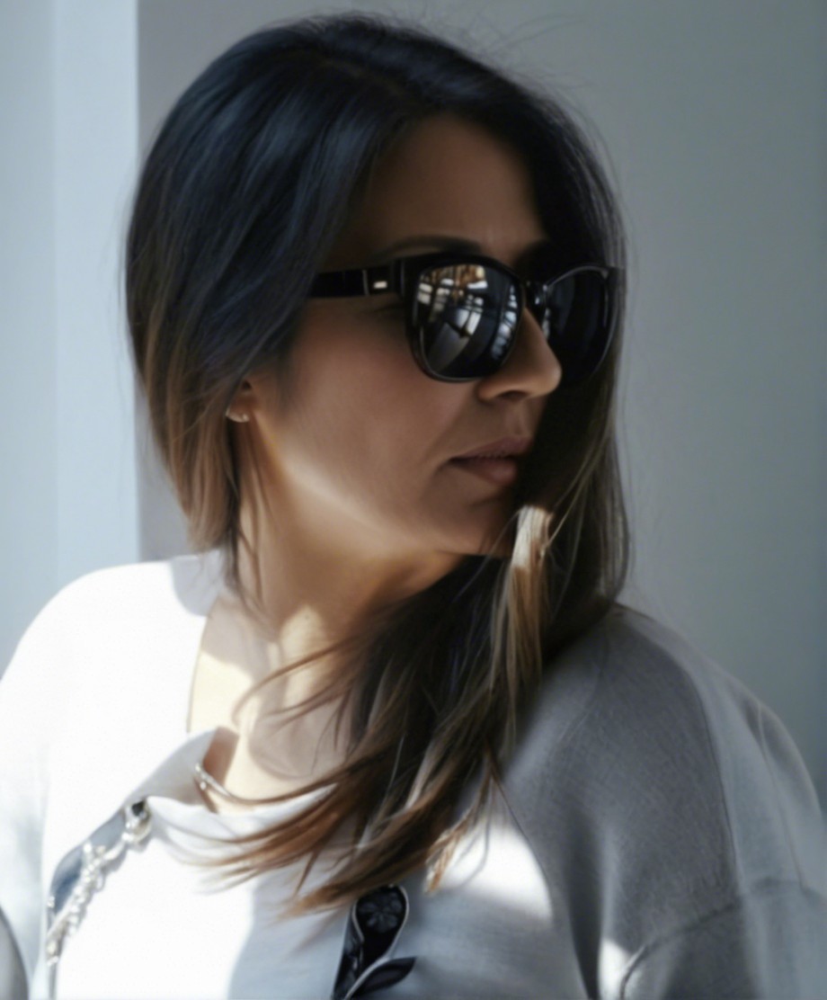 Contemplative Woman in Stylish Sunglasses Profile