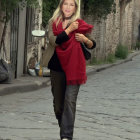Stylish Woman in Elegant Outfit on Cobblestone Street