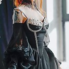 Regal Woman in Elegant Blue Gown and Auburn Hair