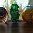 Surreal Artwork Featuring Three Unique Cat Forms