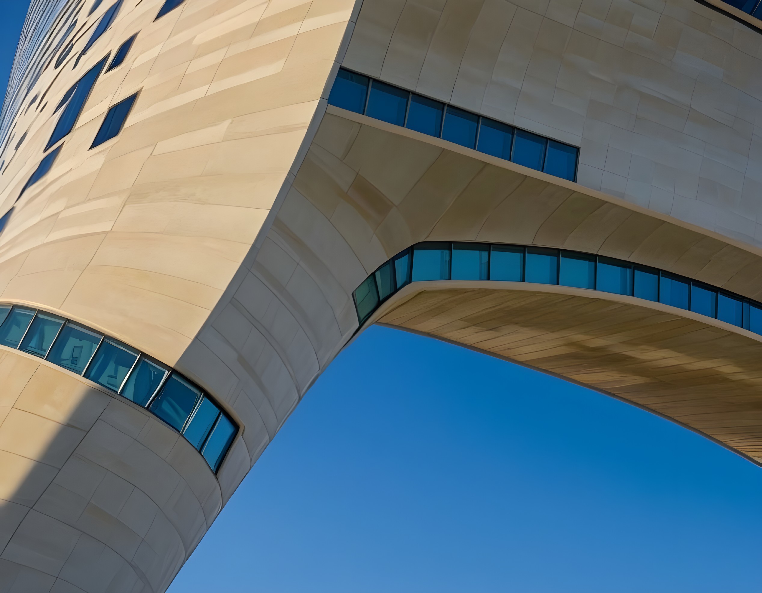 Curvilinear Architectural Design with Stone and Glass