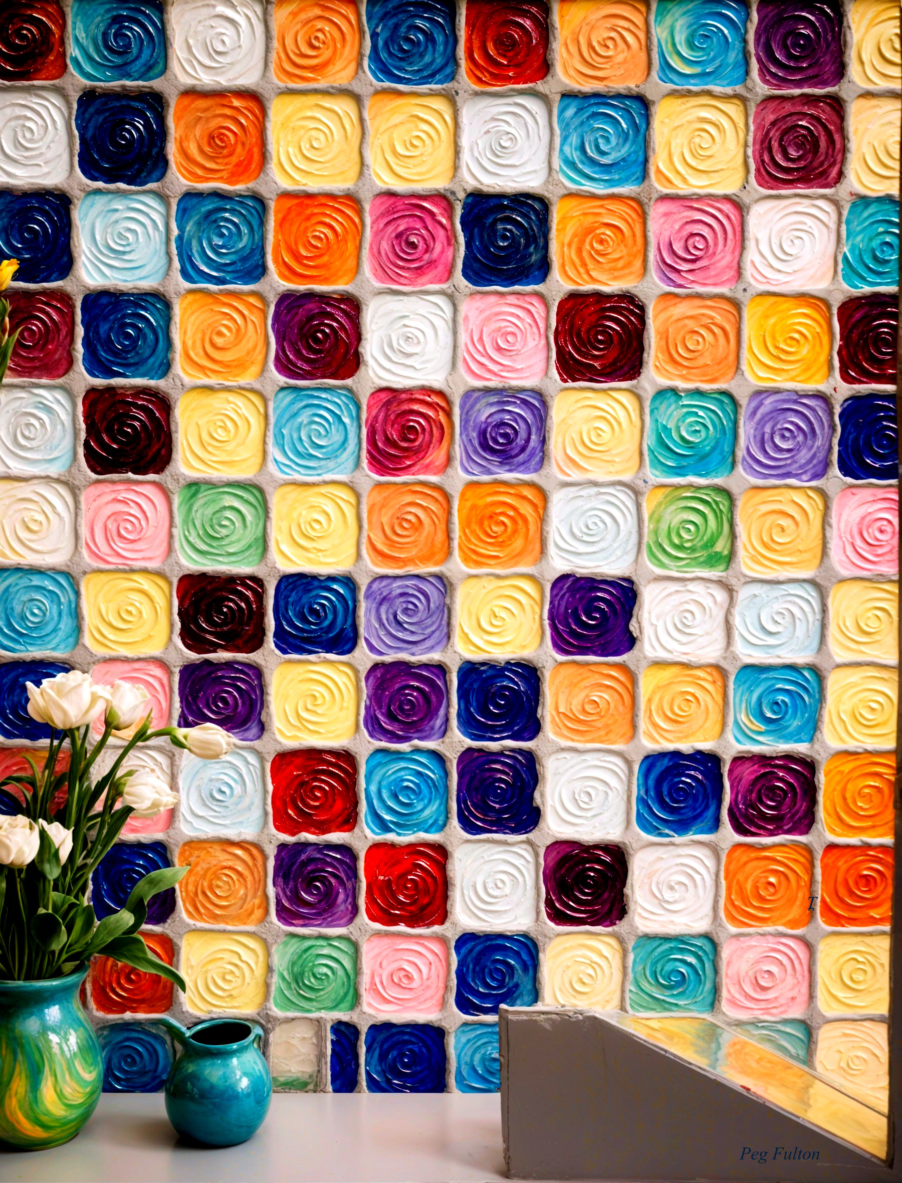 Colorful Rose-Shaped Sculptures on Vibrant Wall