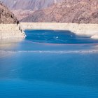 Mythical dragon emerging from ocean waves with colors