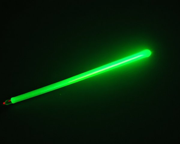 Glowing Green Light Stick on Dark Background