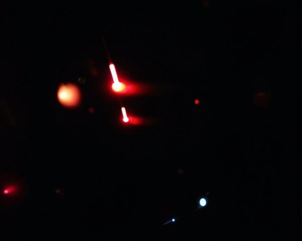 Abstract depiction of glowing orbs in dark space