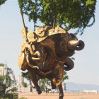 Intricate Elephant Sculpture Surrounded by Lush Greenery