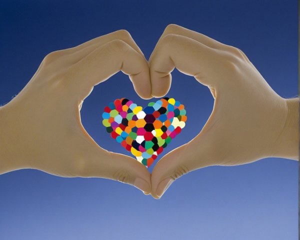 Hands Creating Heart Shape with Colorful Mosaic