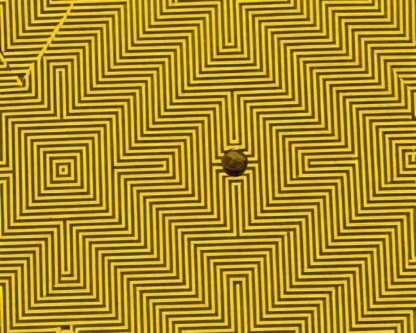 Vibrant Yellow Background with Zigzag and Square Pattern