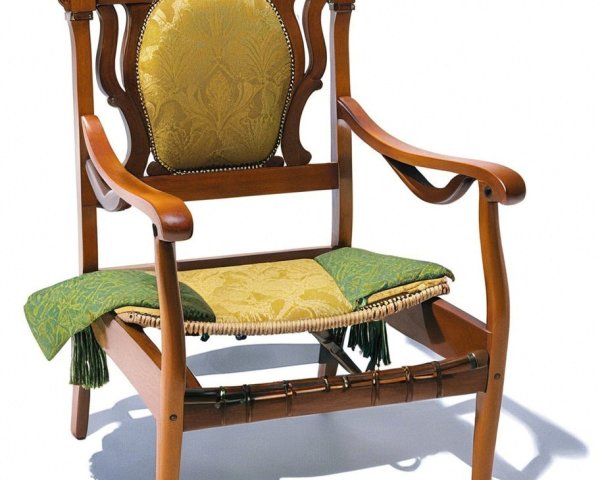 Ornate wooden chair with intricate carvings and upholstery