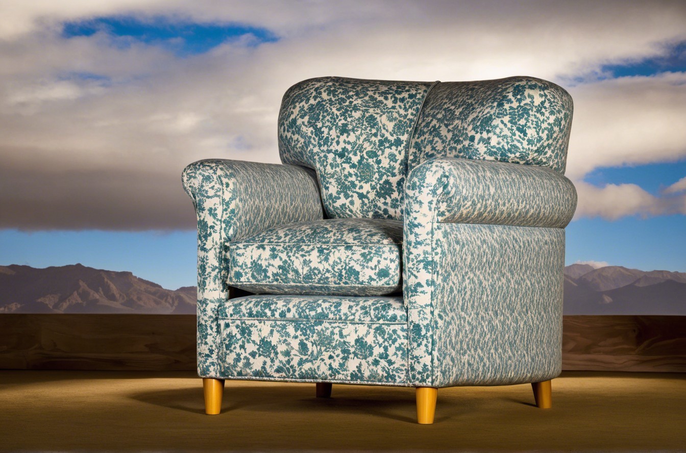 Floral Armchair Against Blue Sky and Rocky Mountains