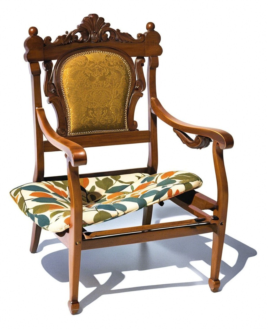 Elegant wooden chair with intricate carvings and upholstery