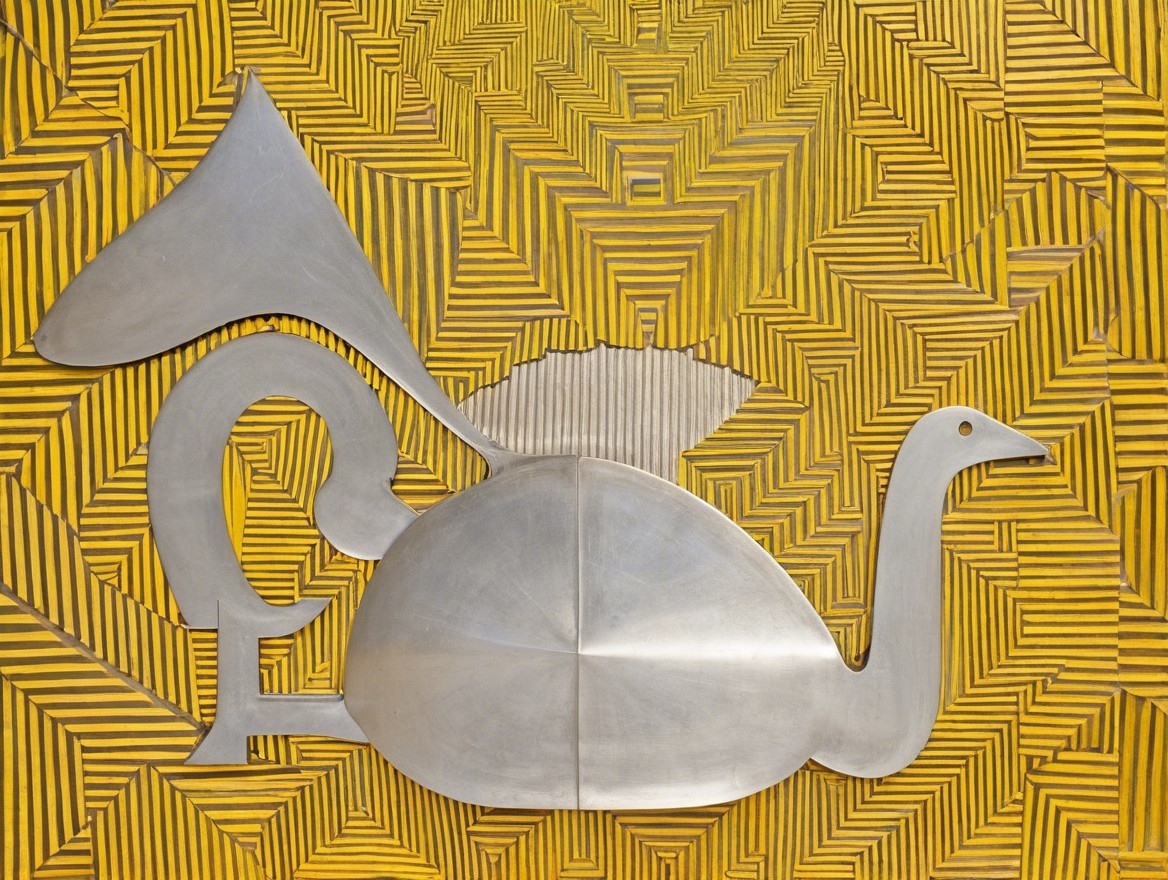 Metal Bird Sculpture with Yellow Geometric Background