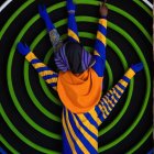 Vibrant Figure in Striped Outfit Against Dynamic Background