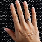 Manicured Hand with Blue-Tipped Nails and Ring