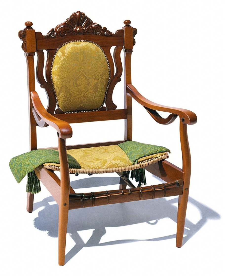 Ornate wooden chair with intricate carvings and upholstery