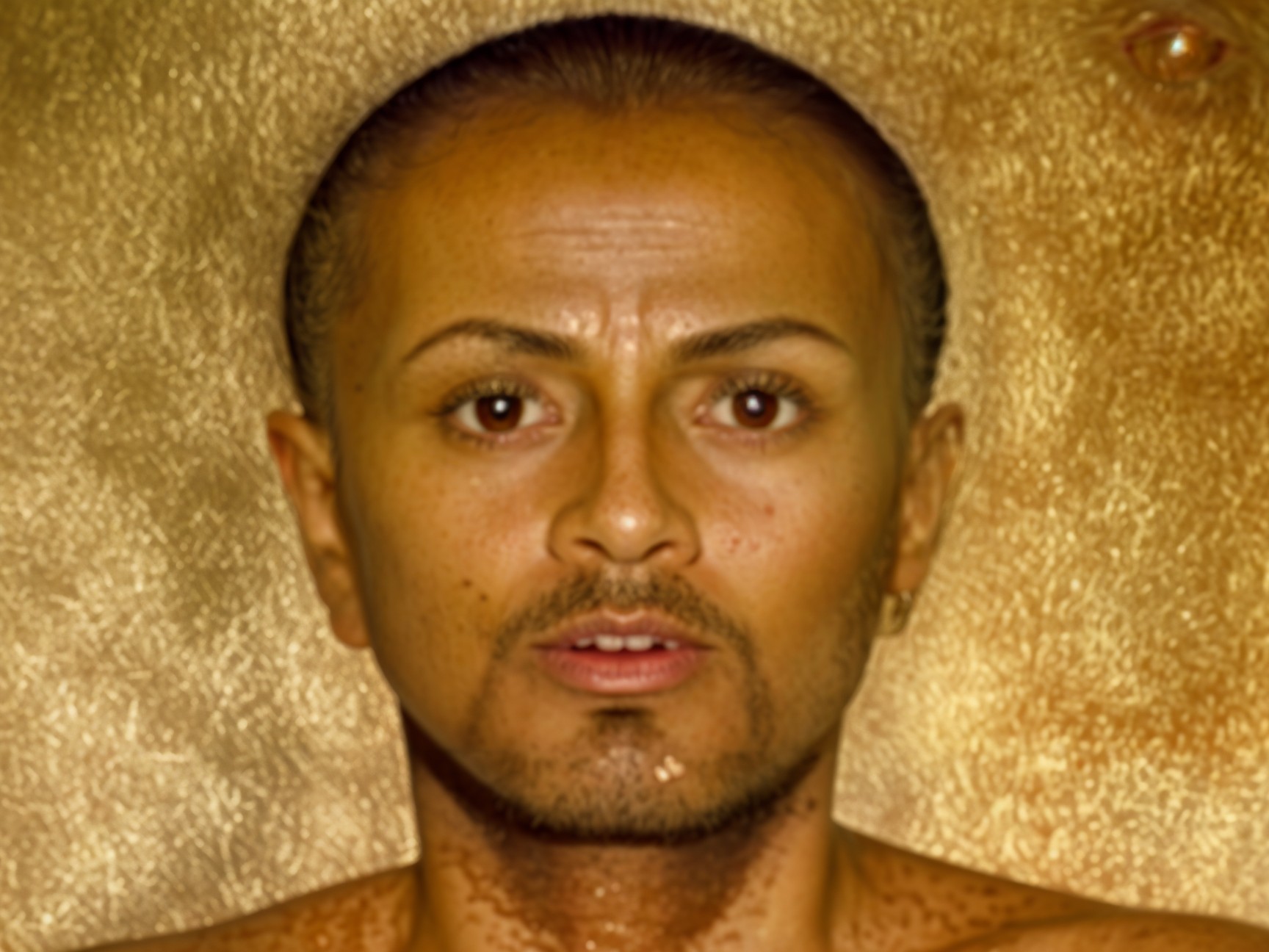 Person with smooth complexion and thoughtful expression