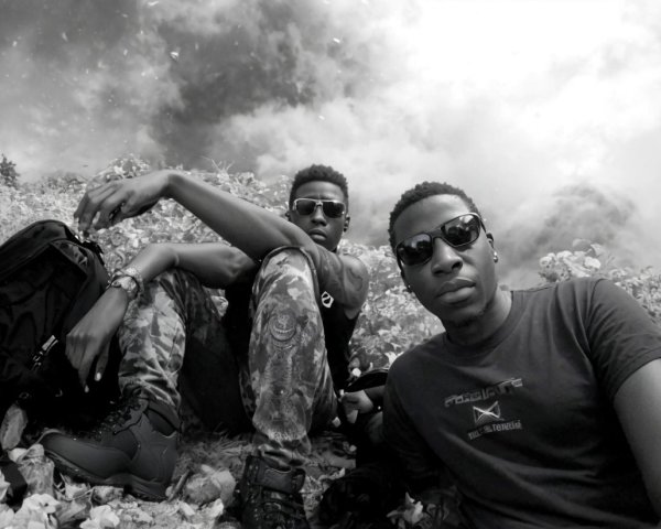 Hikers resting under cloudy sky with sunglasses