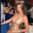 Elegant Woman in Gold Dress at Chic Restaurant