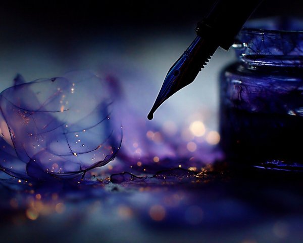 Close-up of Purple Ink Jar and Fountain Pen Arrangement