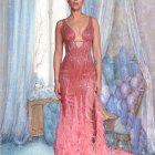 Elegant Woman in Pink Gown with Beadwork Details