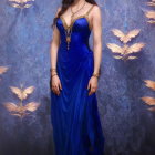Regal figure in blue gown among vibrant flowers