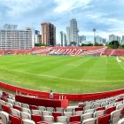Panoramic View of an Empty Soccer Stadium with Skyscrapers