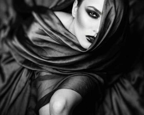 Monochromatic portrait of a woman with dark makeup