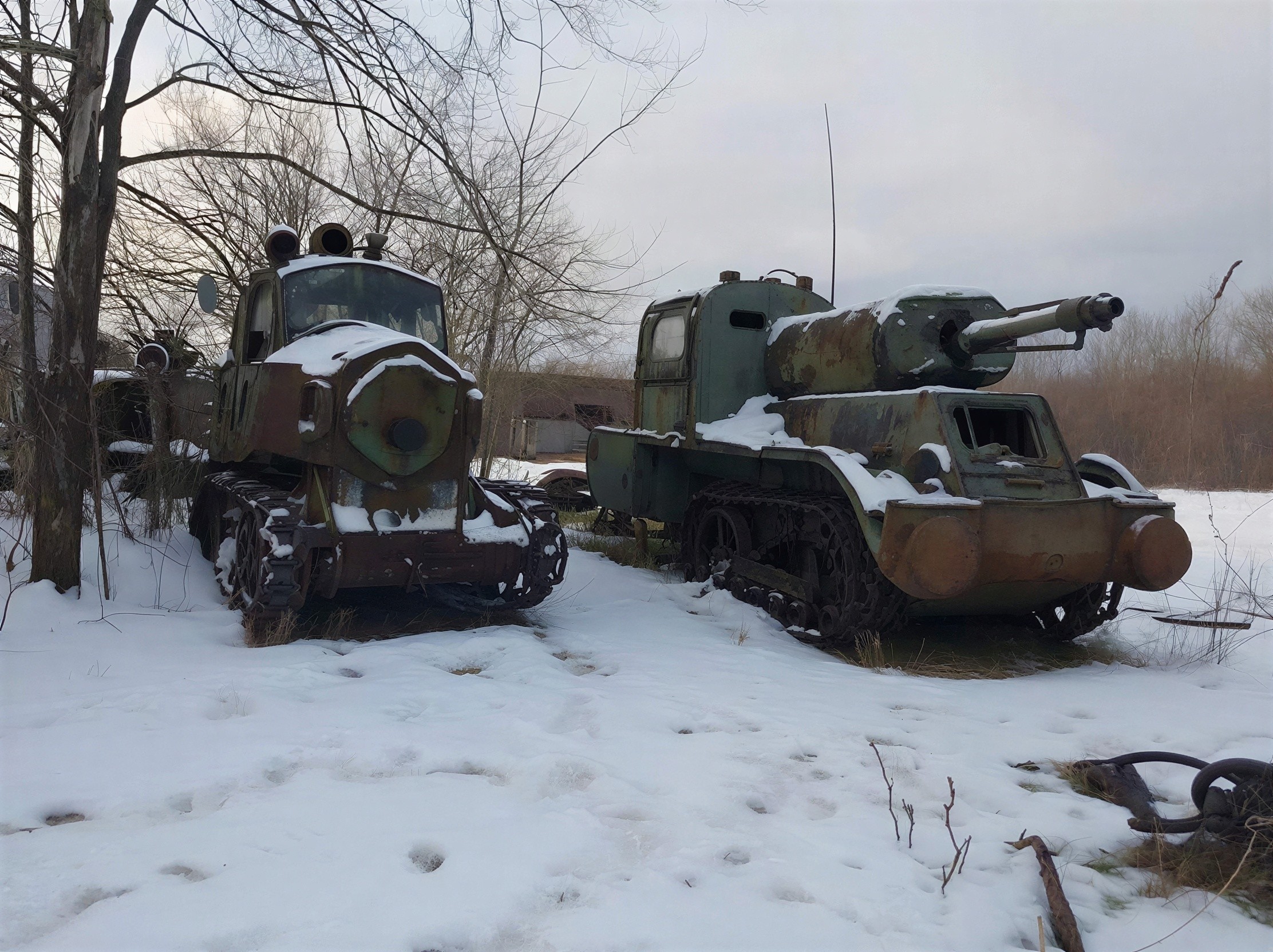 Abandoned Military Vehicles in Snowy Field