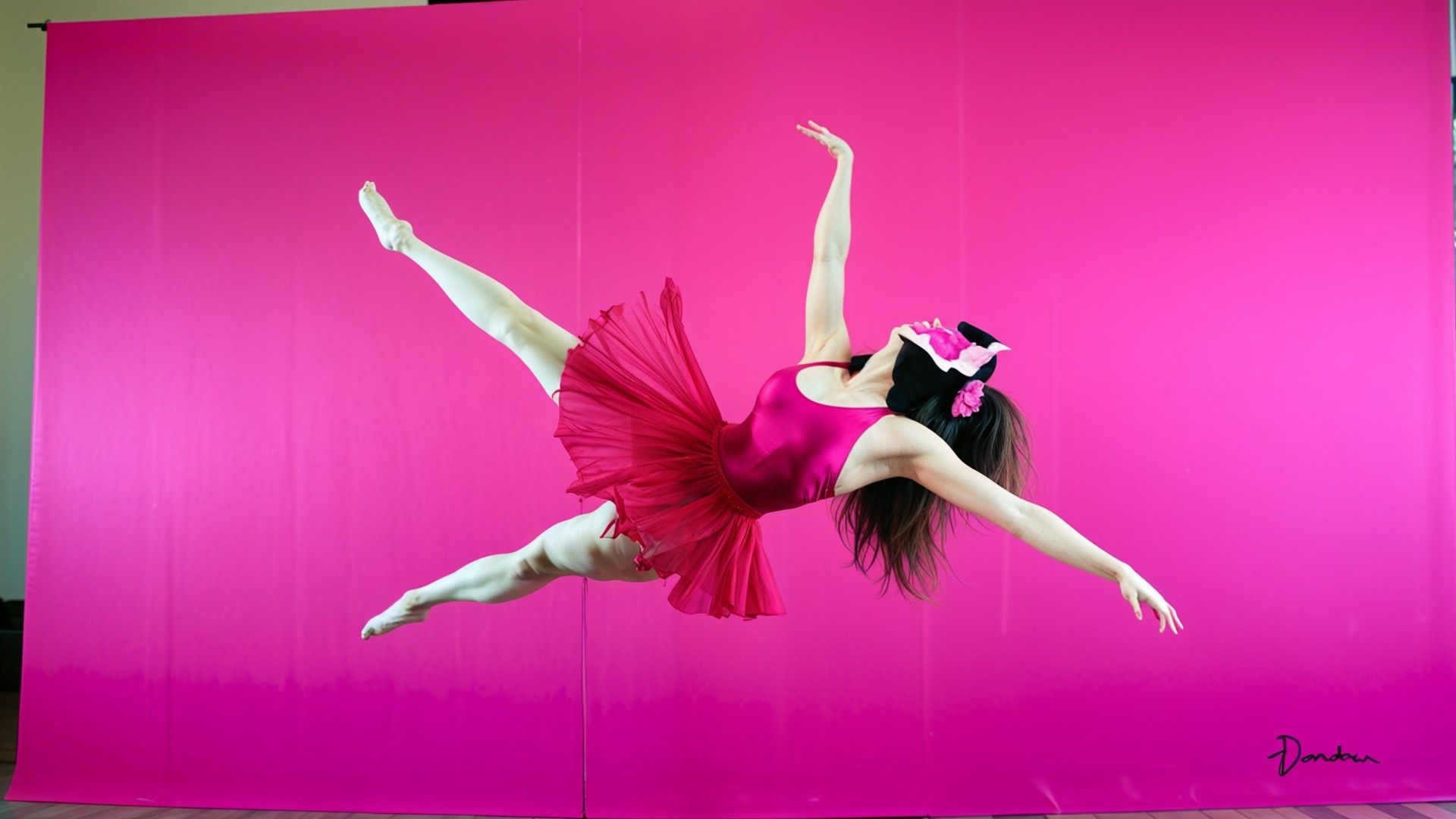 Dancer in Fuchsia Leotard Against Pink Backdrop