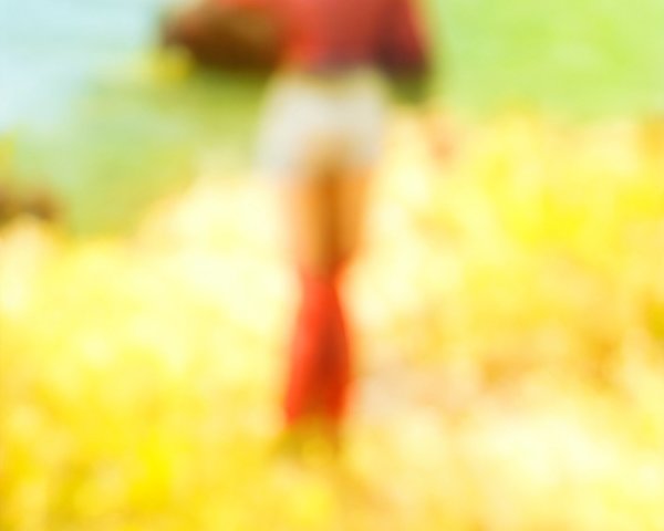 Blurred Figure by Vibrant Green River in Nature