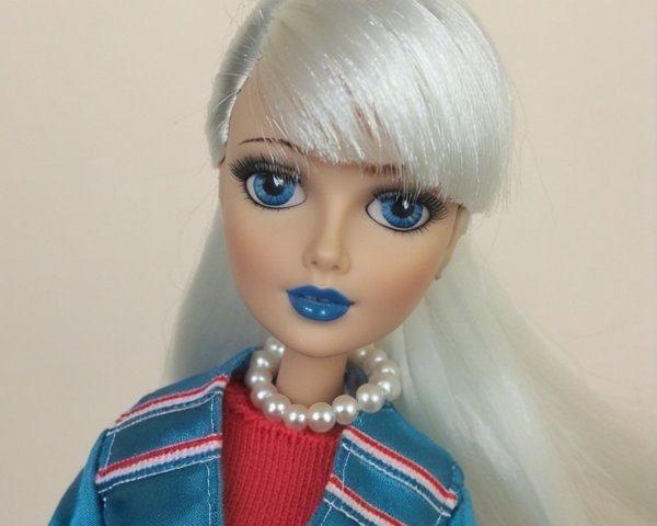 Fashion doll with silver hair and turquoise jacket