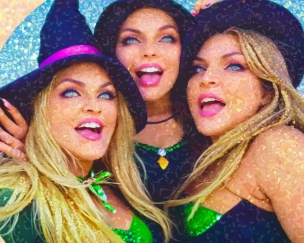 Festive Witch Costumes with Joyful Women in Sparkling Outfits