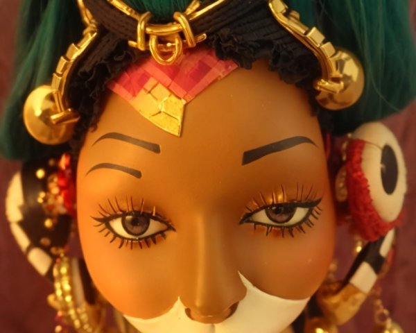 Intricately Designed Doll with Vibrant Accessories