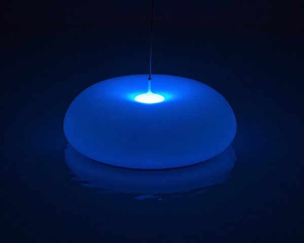 Dome-Shaped Object Emitting Soft Blue Glow on Water